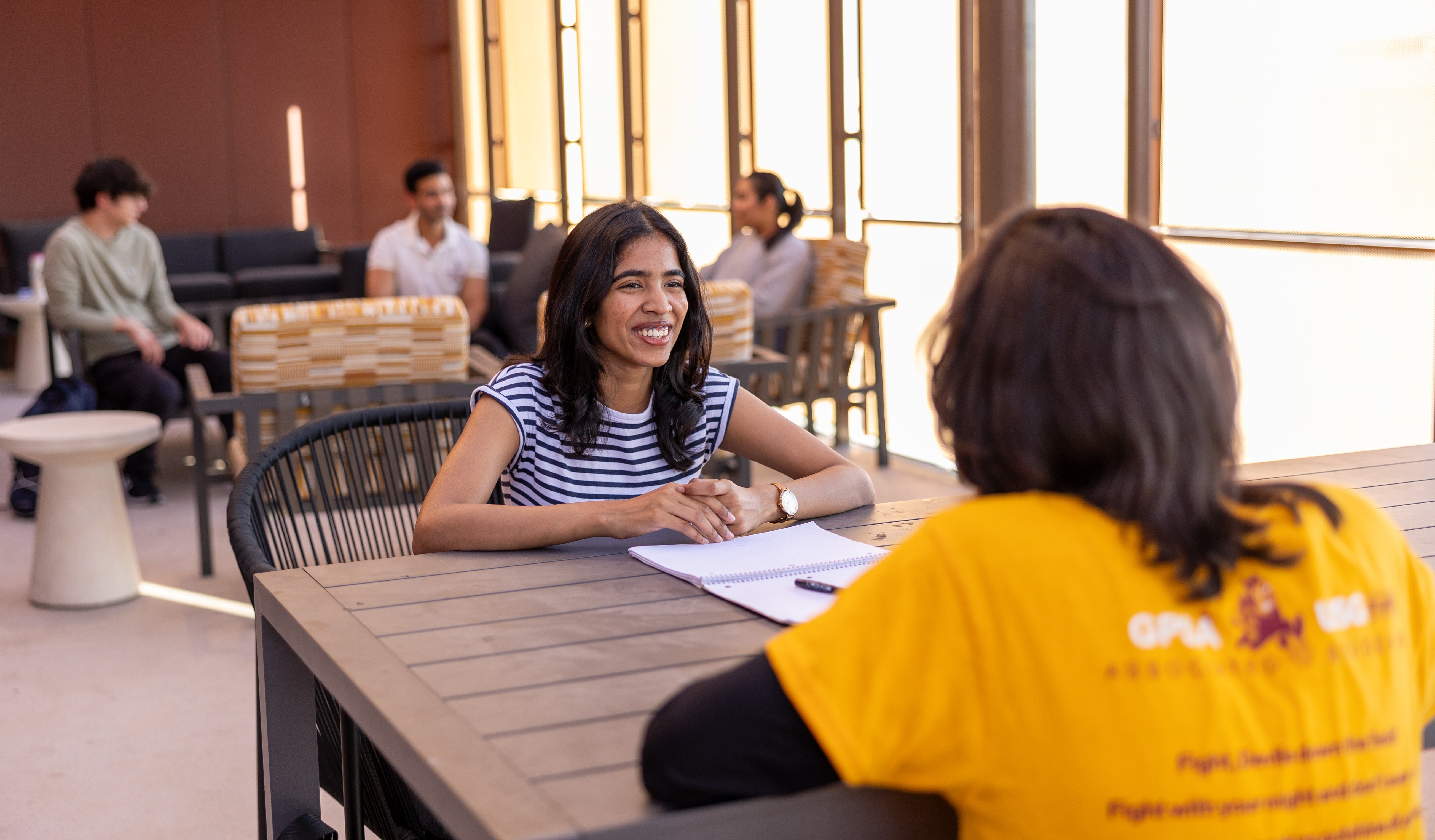 two students, one is mentoring the other