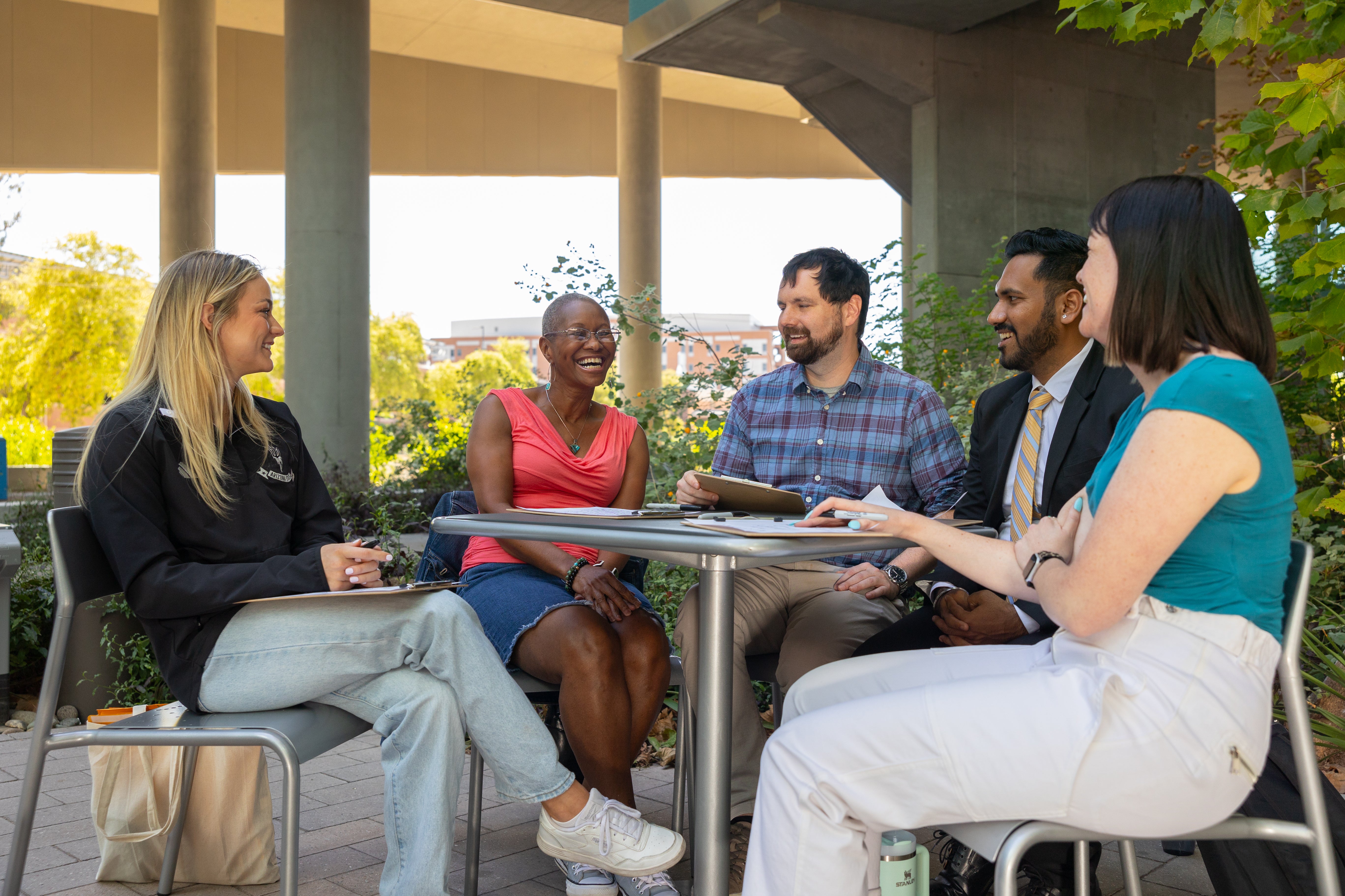 a group of students talking outside