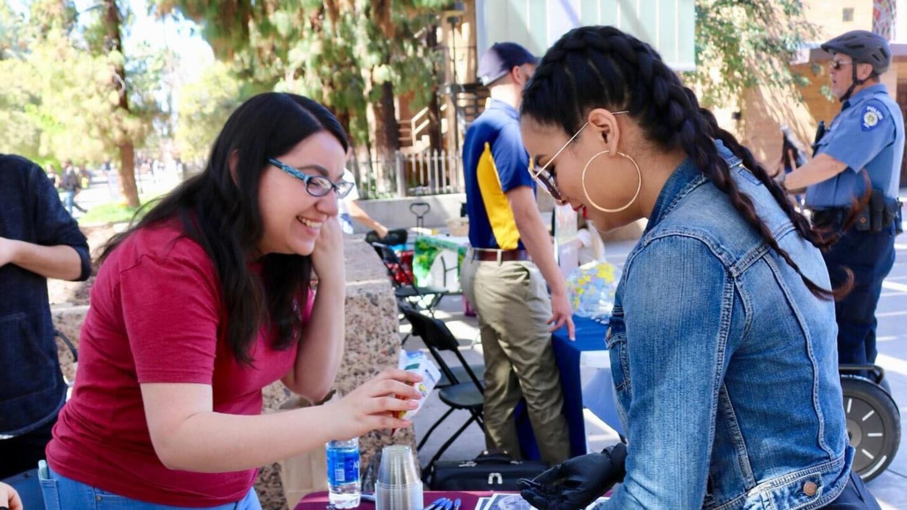 Barbosa shows seeds to a visitor during a fair