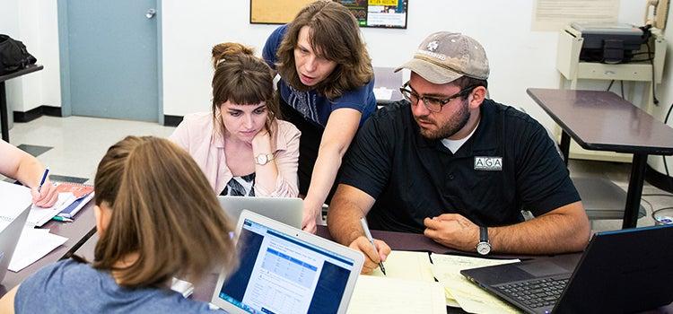 people_with_laptops_working_on_a_table.jpg